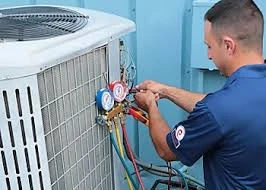 HVAC technician checking pressure gauges on an outdoor system
